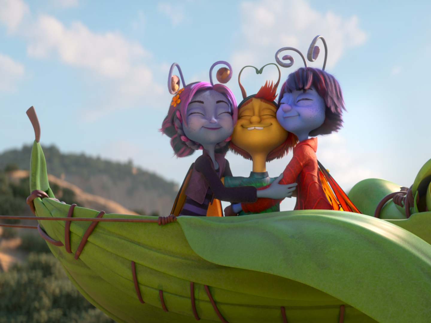 3 main characters hugging each other